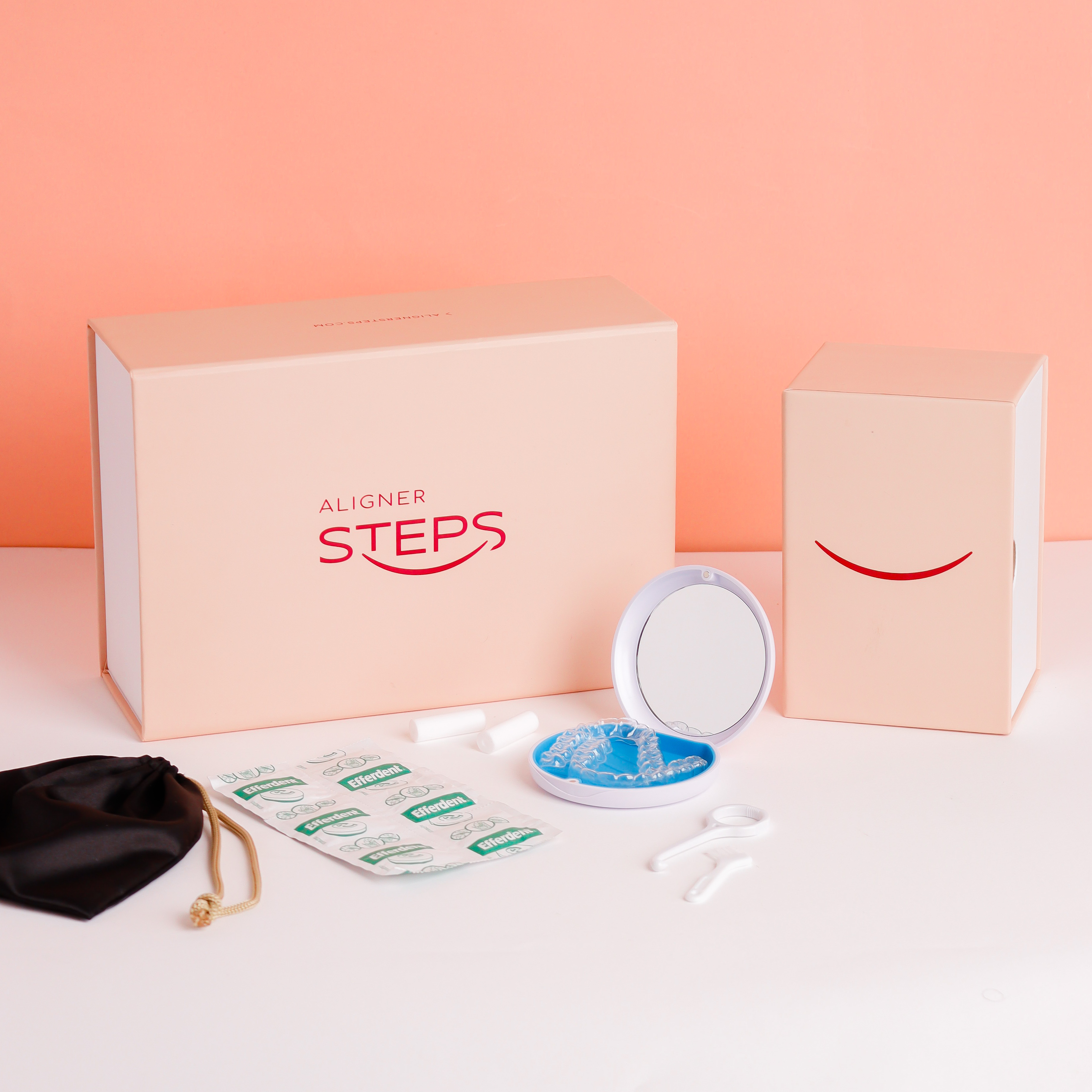 Dental clinic consultation — two staff members at reception desk